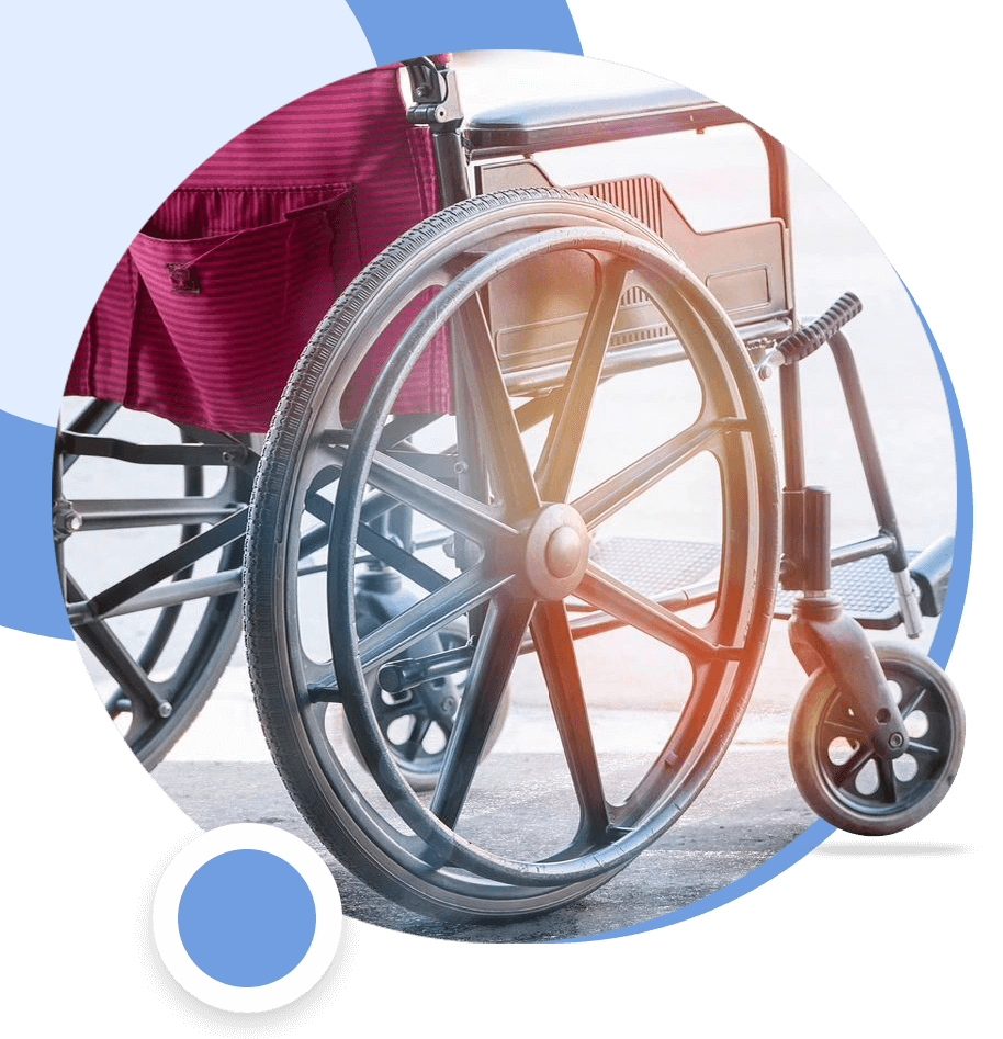 A wheel chair with the wheels down and a red seat.